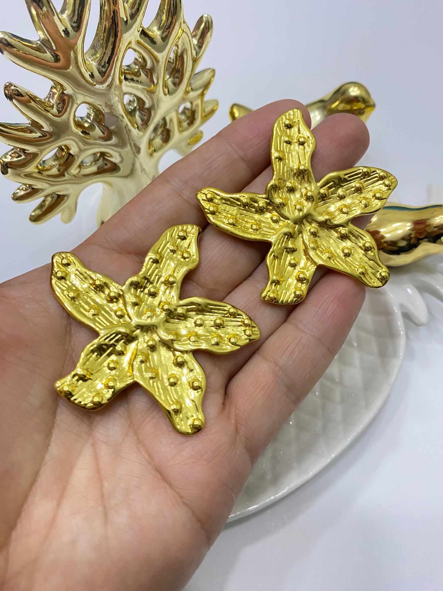 Aros Flor acero dorado textura