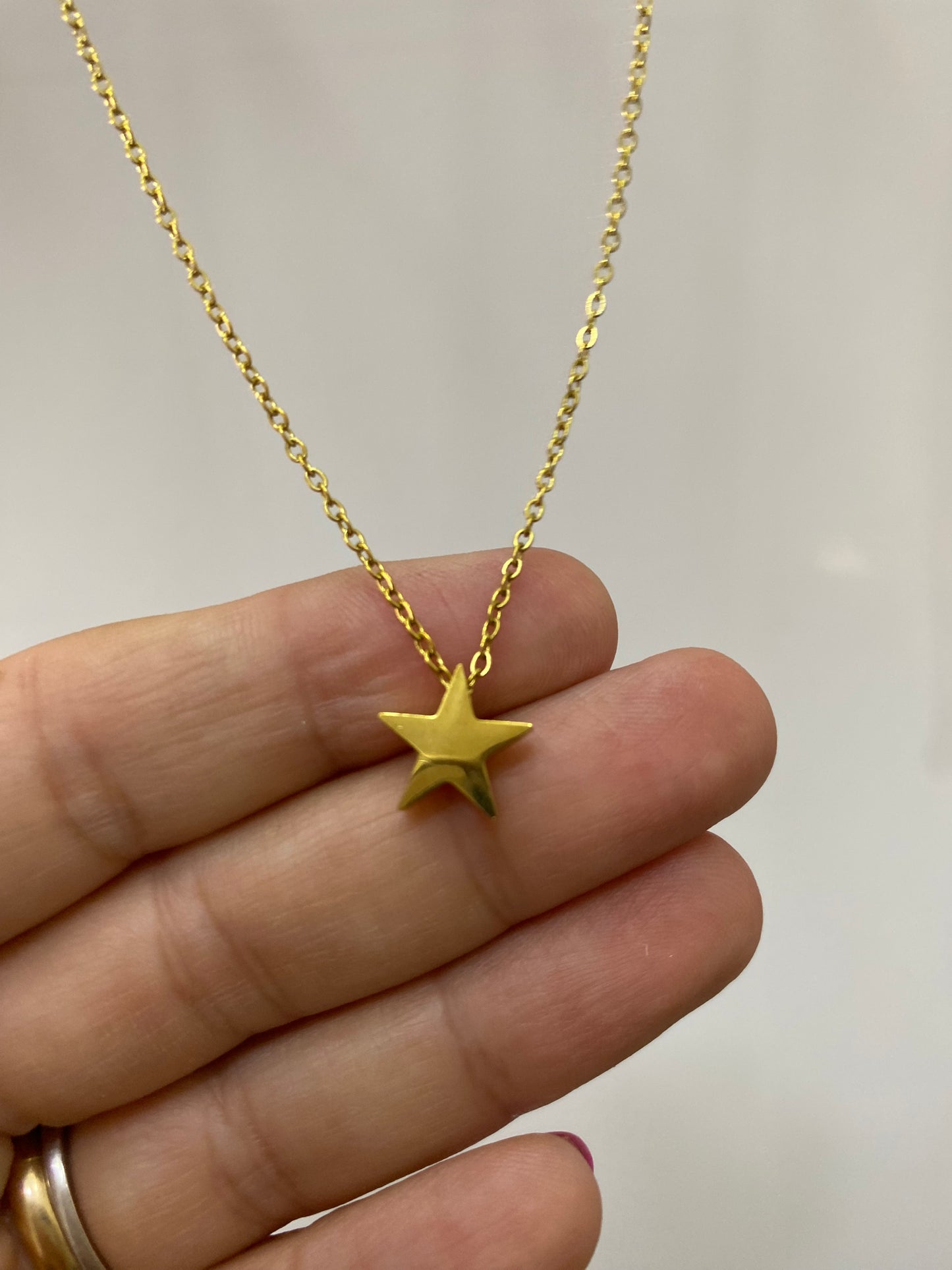 Collar Estrella acero dorado