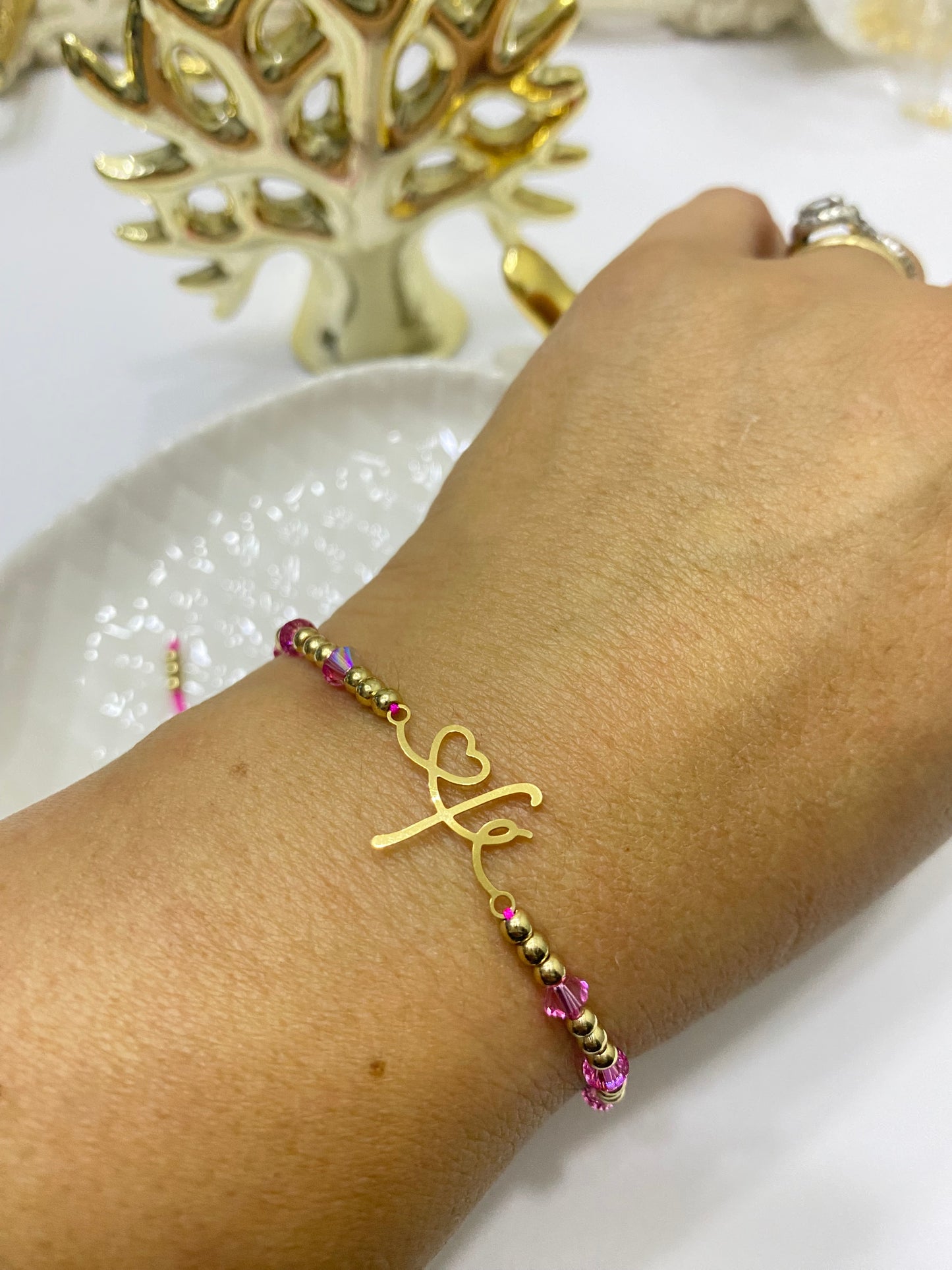 Pulsera Fe y cristales Swarovski fucsia • ajustable