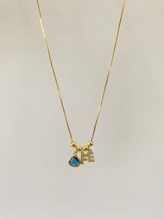 Collar fe con microcircones engastados en baño de oro gema azul