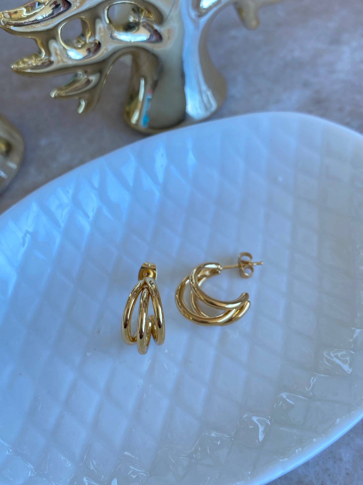 Aros Trinidad acero dorado
