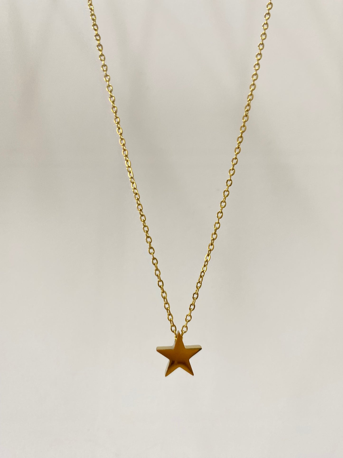 Collar Estrella acero dorado