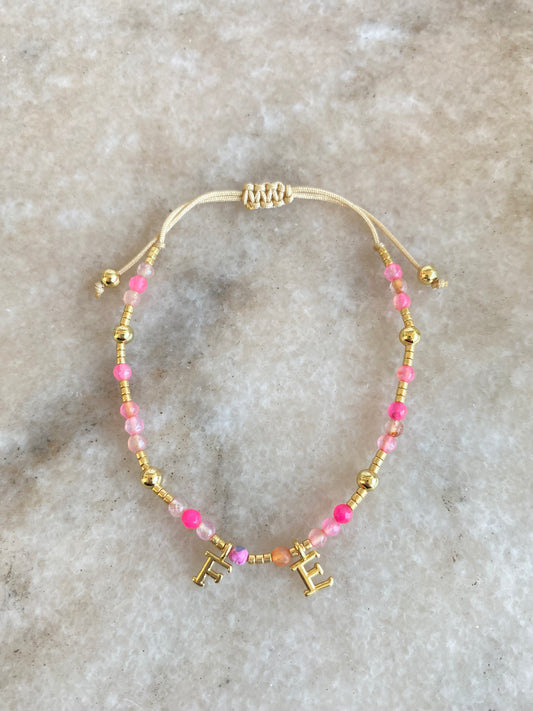 Pulsera Fe y piedras naturales rosa-fucsia ajustable