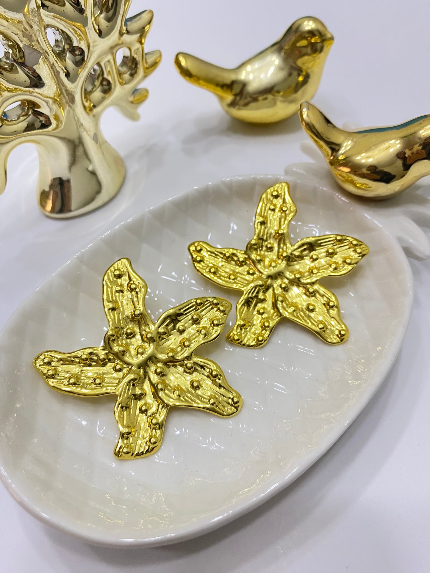 Aros Flor acero dorado textura