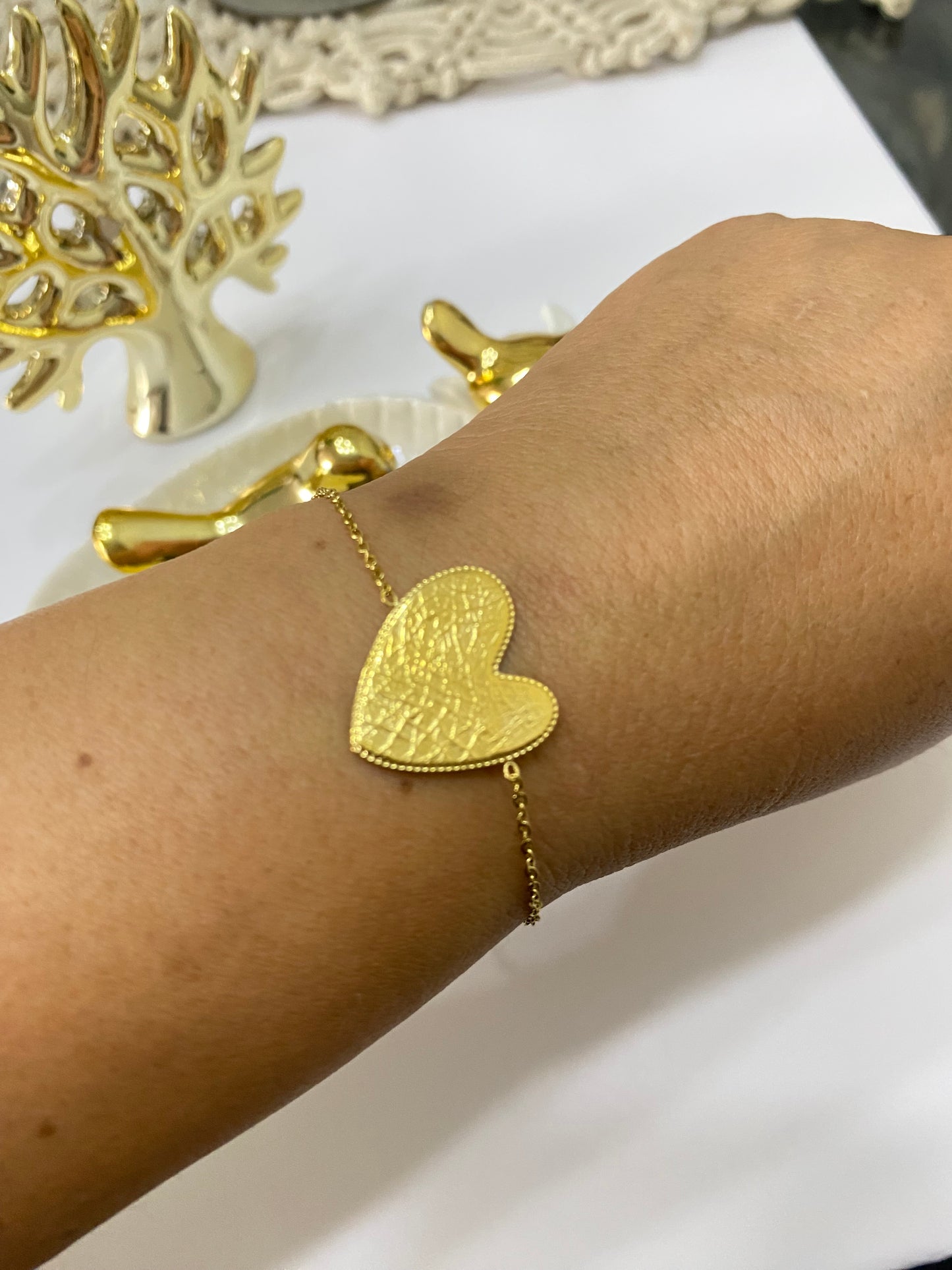 Pulsera corazón  de acero dorado